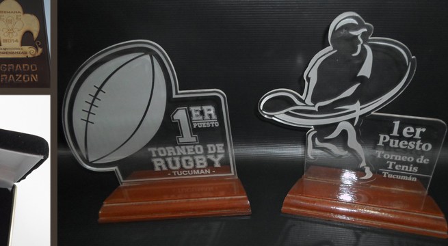 Trofeos acrílicos grabados de un torneo de rugby y uno de tenis en Tucumán
