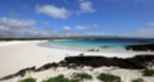 Playa de arena blanca y aguas cristalinas cerca de Puerto Baquerizo Moreno, San Cristóbal