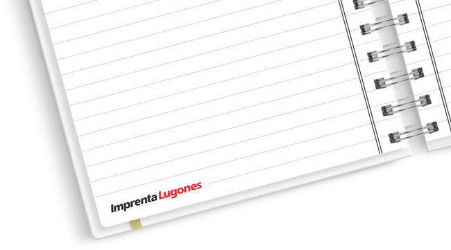 Interior de cuaderno rayado con el logo de Imprenta Lugones en la esquina