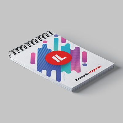 Cuaderno espiralado con diseño geométrico colorido y logo de Imprenta Lugones en la tapa
