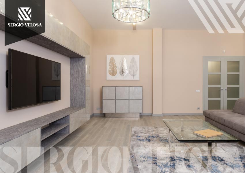 Mueble bajo de TV con acabado en piedra gris y sala en tonos neutros